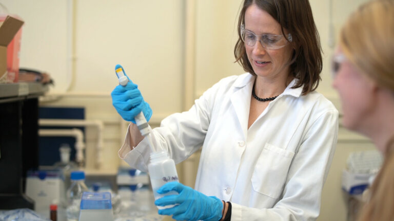 Christy Remucal holding a syringe.
