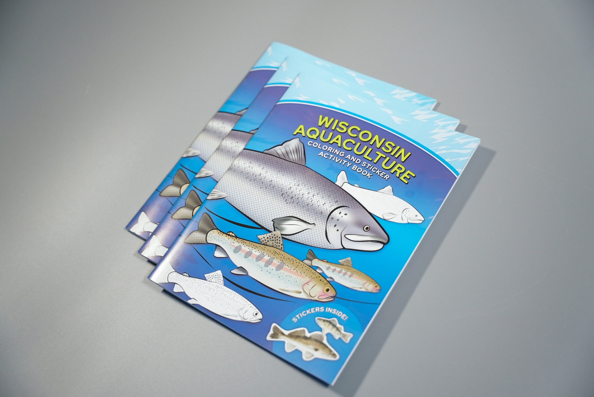 three copies of wisconsin aquaculture coloring and sticker activity book