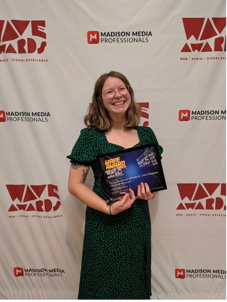 Bonnie Willison holding her two WAVE video awards.
